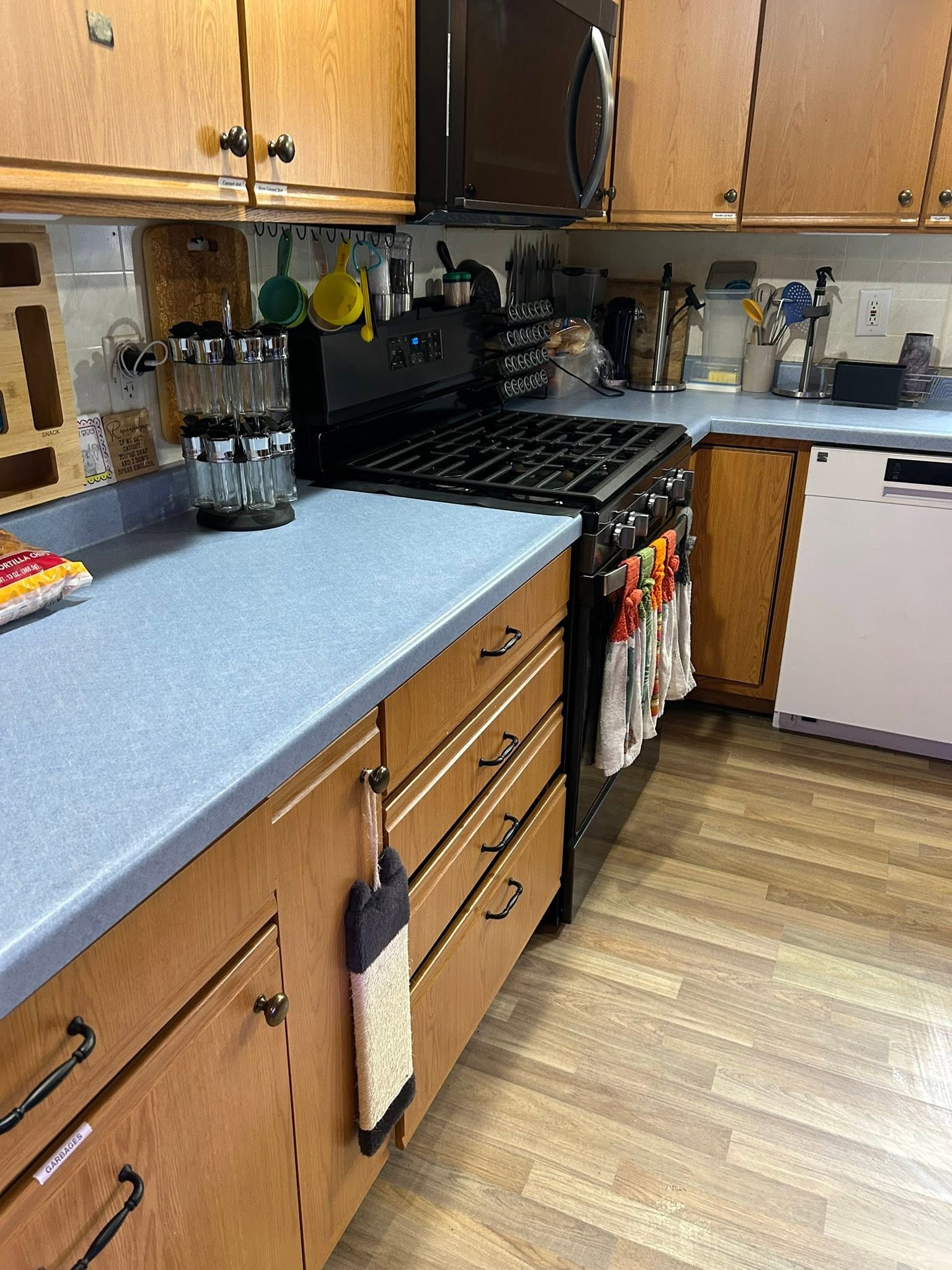 The same kitchen after a GC clean, counters cleared and wiped with everything reset