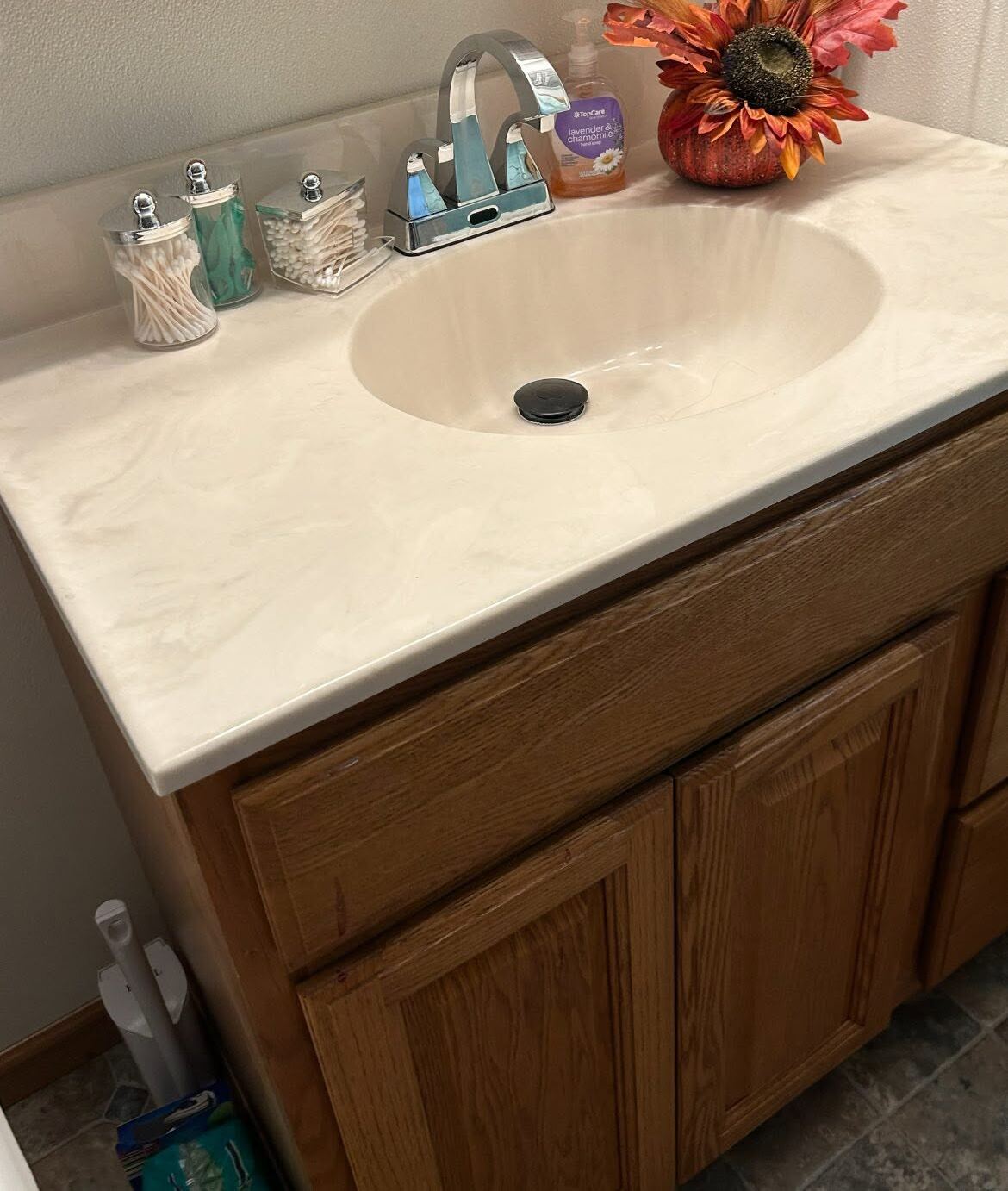 The same vanity after a GC clean, cleared, polished, and staged